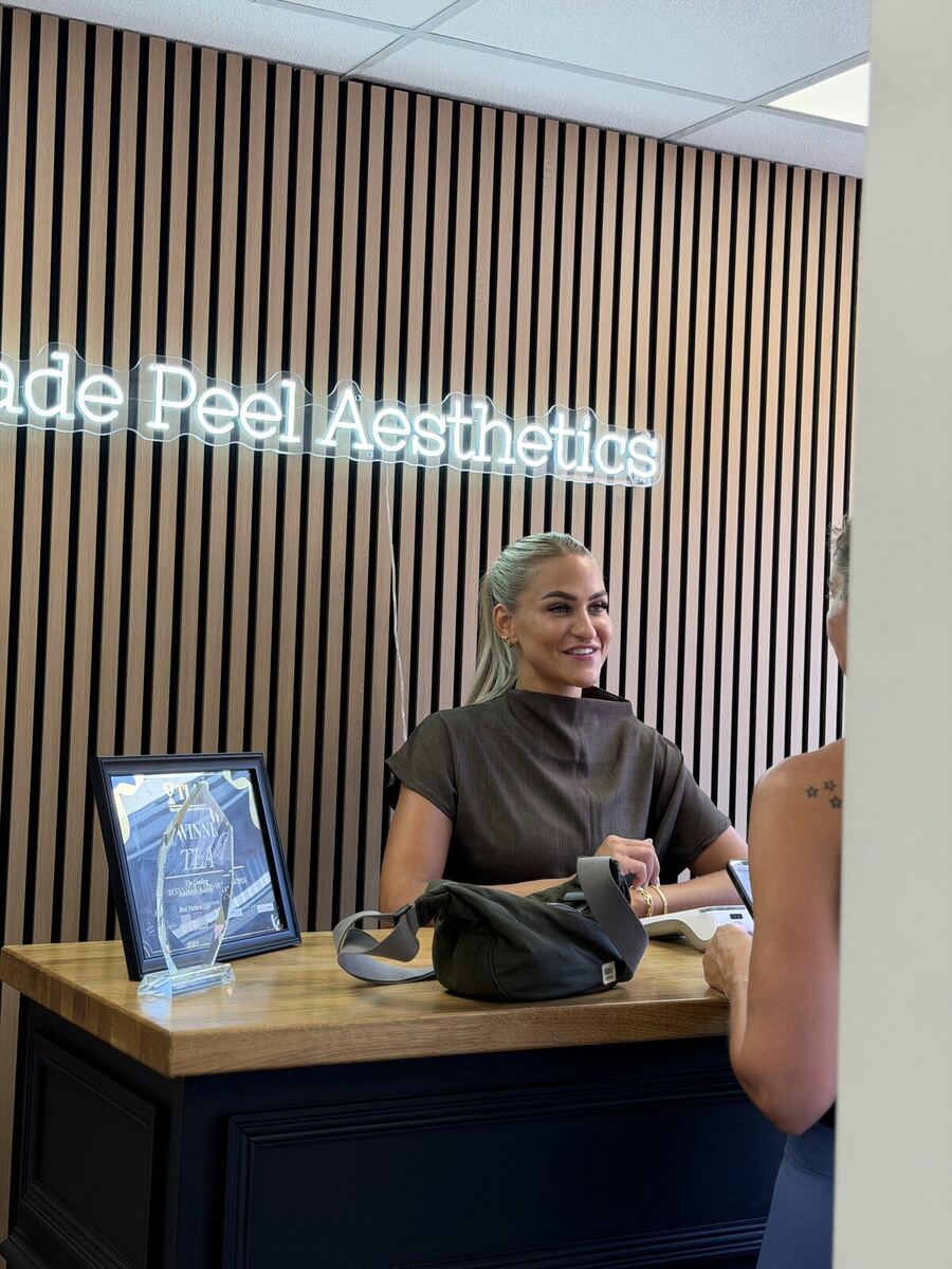 Reception desk under the illuminated sign