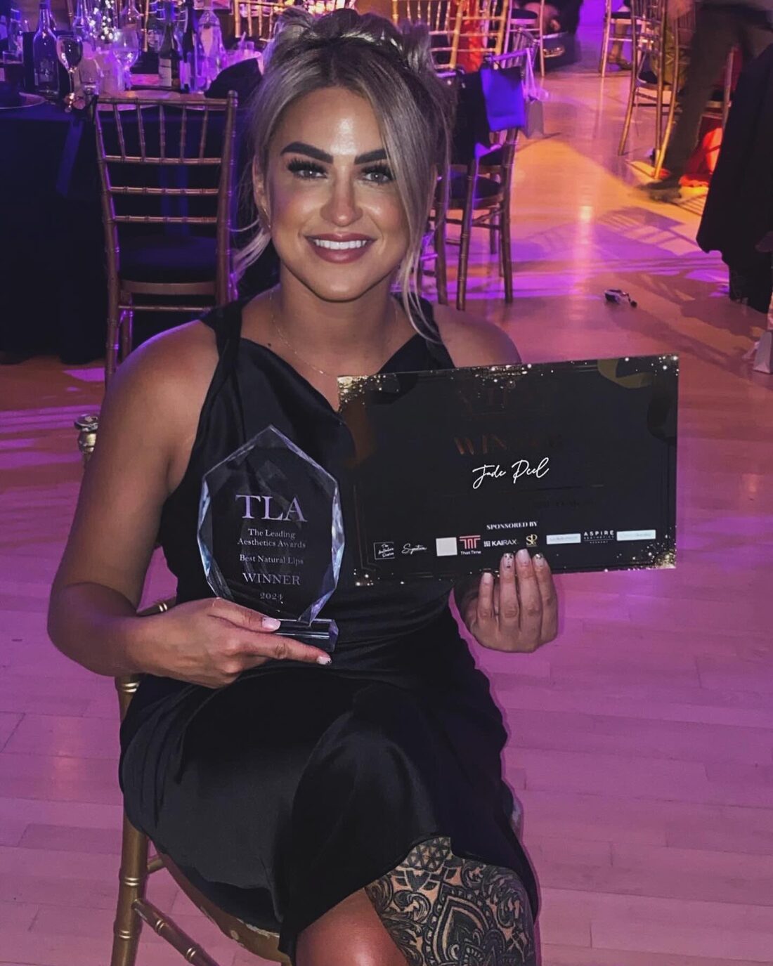 Jade Peel with her Best Natural Lips 2024 trophy and certificate