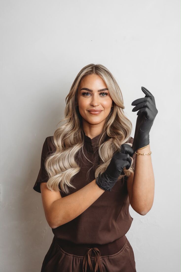 Jade Peel smiling in her clinic scrubs